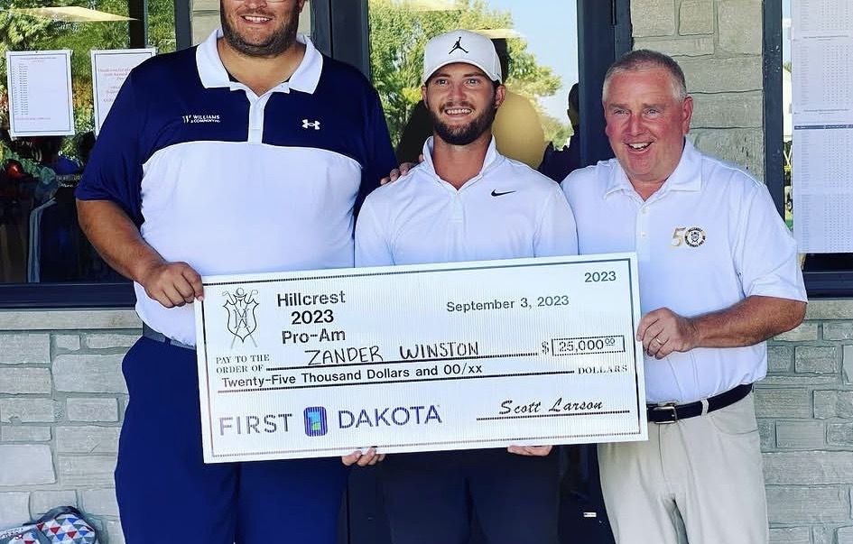 Zander holding the $25,000 Hillcrest Pro-Am winner's check