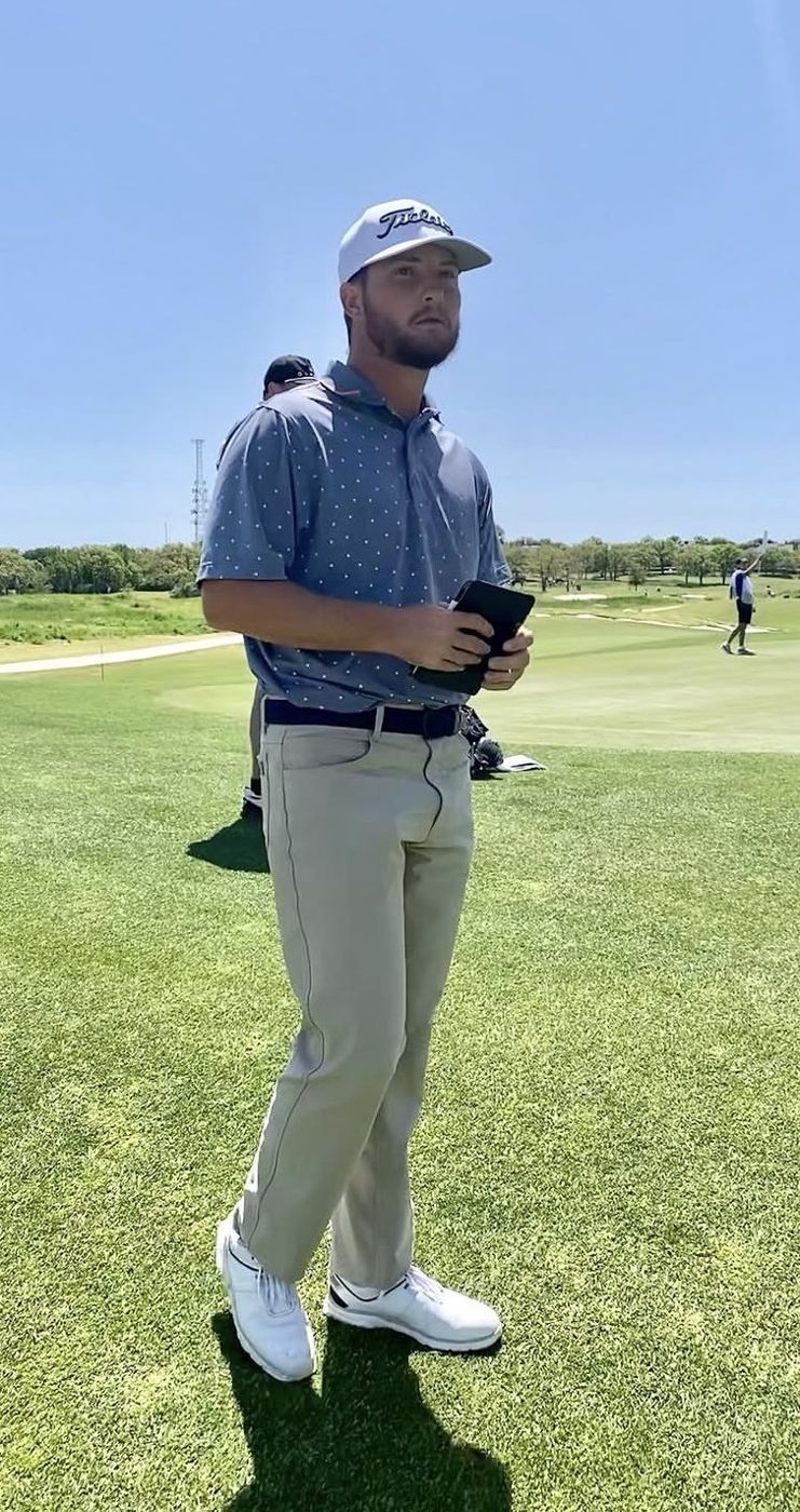 Zander on the course in a Titleist cap